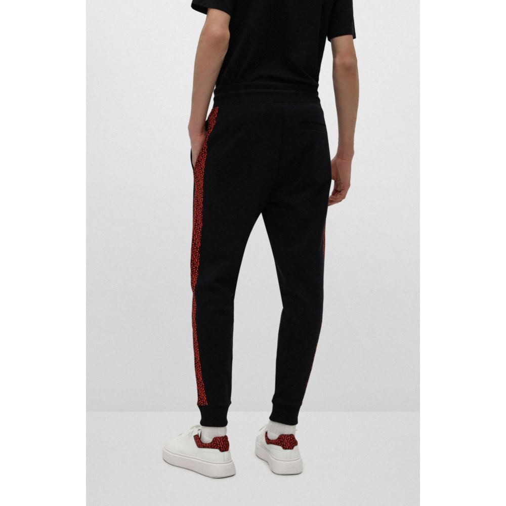 HUGO - Cuffed tracksuit bottoms in French terry with contrast logo